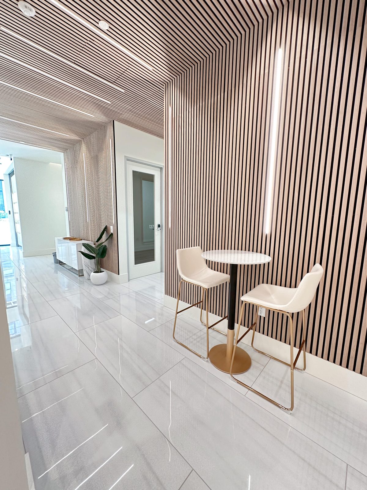 MINT suite corridor with high-top table